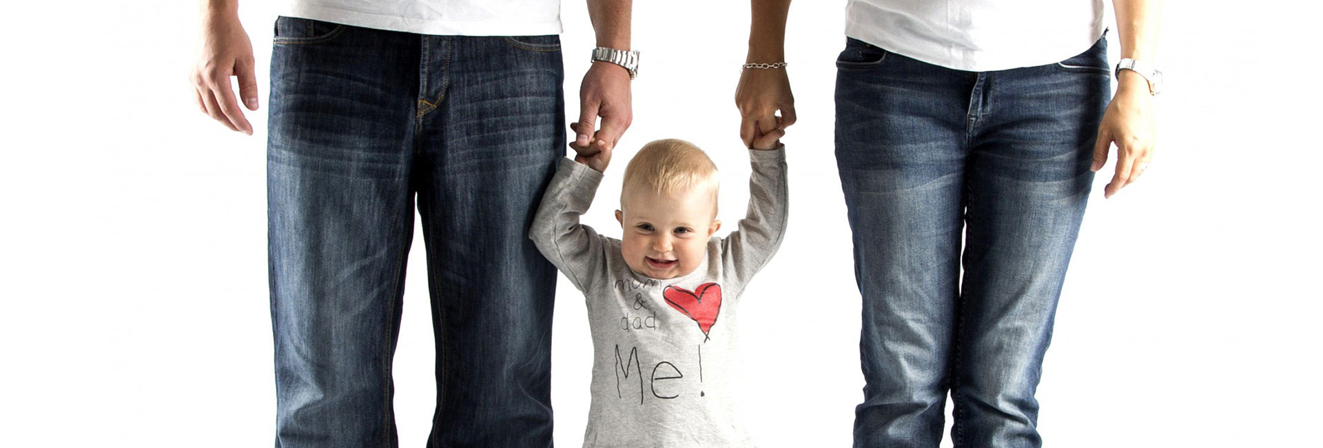 Parents holding a childs hand