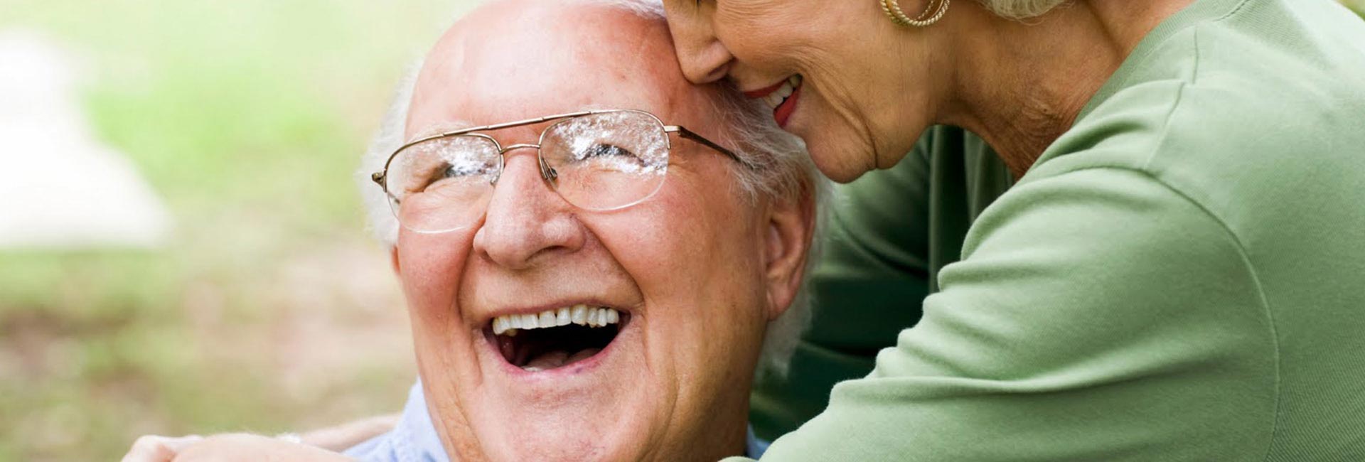 Elderly couple laughing